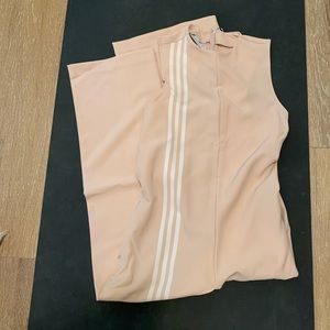Adidas pink jumpsuit with tags. Runs large.